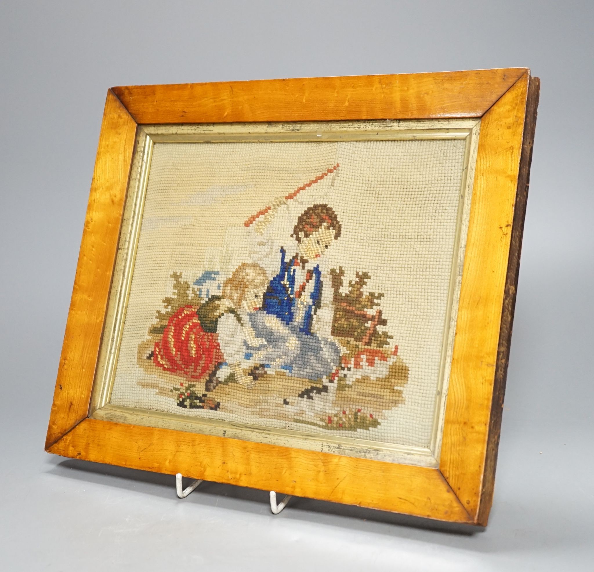 A Victorian maple framed woolwork picture, children playing with cats and dogs, 20x25cm excl frame